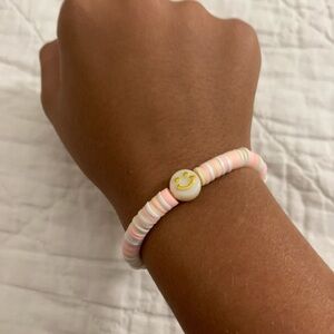 Cute pink and tan smiley face bracelet
